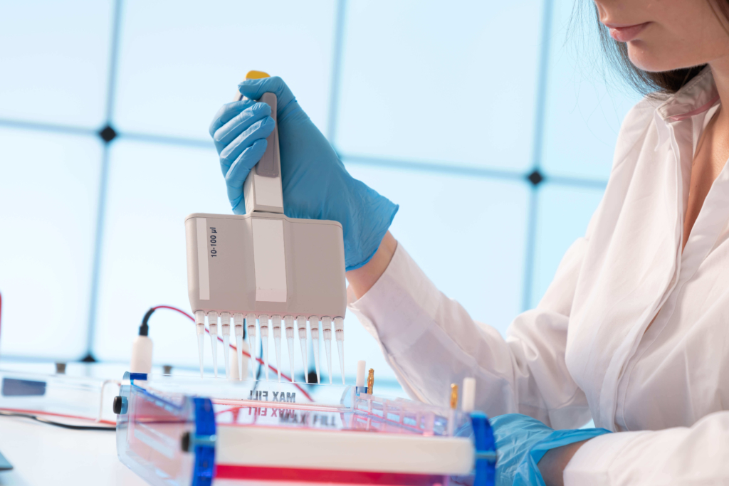 Clinical Acccelerator Initiative scientist preparing DNA test in lab